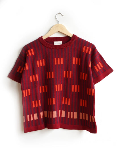 Endery Bauhaus short sleave sweater tee in Solsitce red, orange, and burgundy