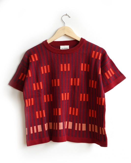 Endery Bauhaus short sleave sweater tee in Solsitce red, orange, and burgundy