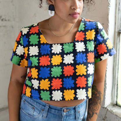 Abstract floral on black backround crop top with a square neckline by Ersa Fibers at Clad, a sustainable clothing boutique in Asheville, North Carolina.