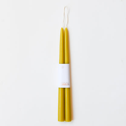 12" taper candles in a set of two in citrine chartreuse yellow.