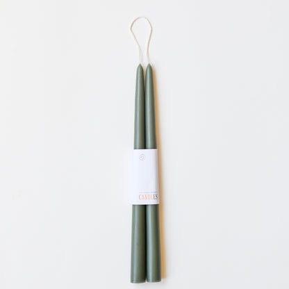 12" taper candles in a set of two in moss green.