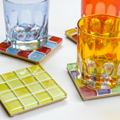 Vibrant, colorful glass tile coasters by Subtle Art Studios in Summer Sprinkles, Love Letter, Banana Frosting, and Candy Cone. Paired with Rialto Old Fashioned Glasses by Sir Madam.