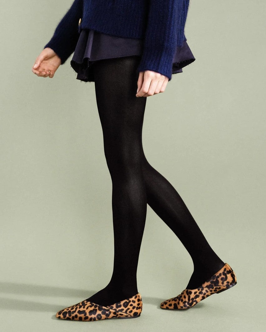 Black opaque tights by Hansel from Basel. Paired with leopard flats and a navy knit caridgan sweater and French navy mini skirt.