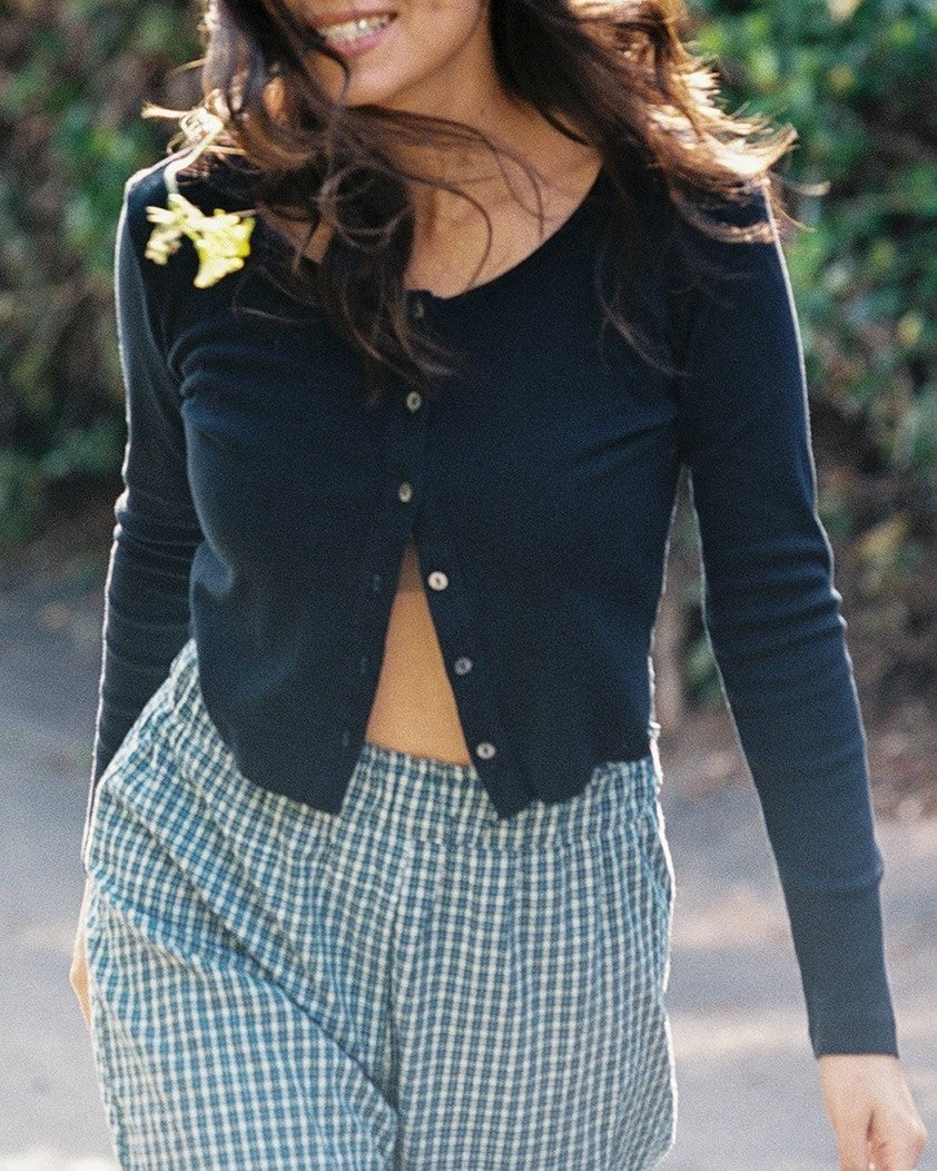 Black cotton cardigan paired with plaid gingham elastic pants