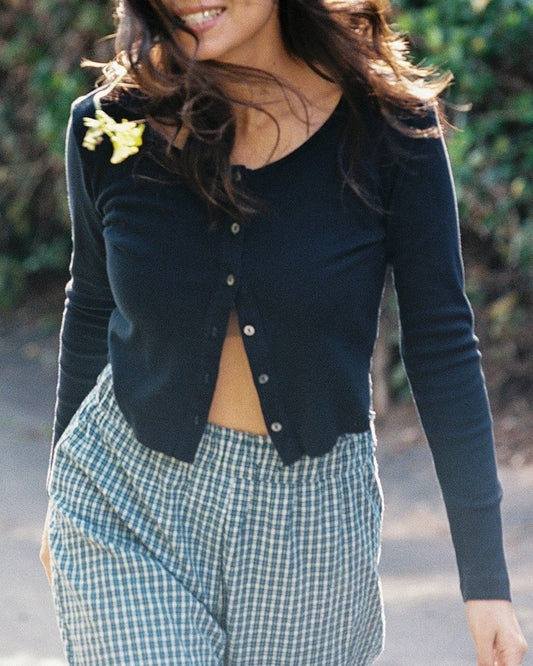 Black cotton cardigan paired with plaid gingham elastic pants