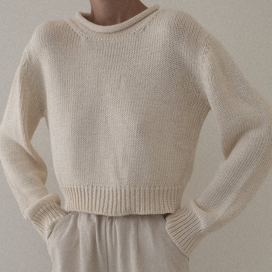 Ivory Mare Rolled Neck Sweater by Laude the Label. Paired with beige ivory wide leg pants with an elastic waistband.