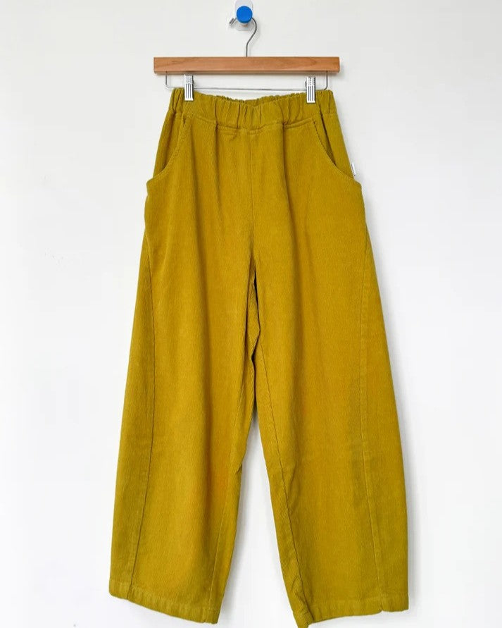 Chartreuse green olive corduroy arc pants by Le Bon Shoppe at Clad, a sustainable clothing store in Asheville, NC