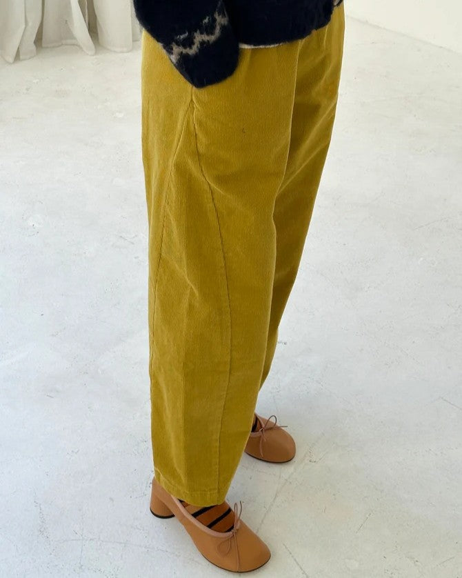 Chartreuse green olive corduroy arc pants by Le Bon Shoppe at Clad, a sustainable clothing store in Asheville, NC