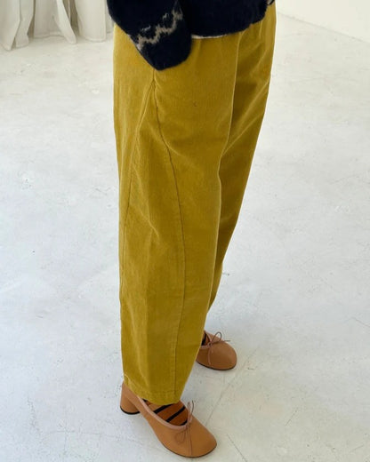 Chartreuse green olive corduroy arc pants by Le Bon Shoppe at Clad, a sustainable clothing store in Asheville, NC