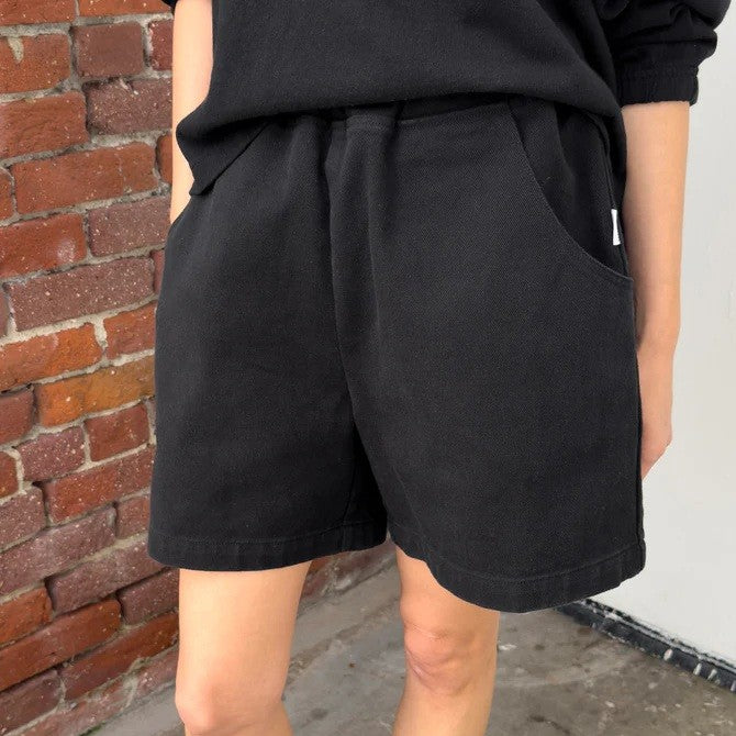 Black cotton cavas elastic high waisted city shorts by Le Bon Shoppe