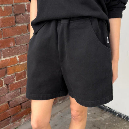 Black cotton cavas elastic high waisted city shorts by Le Bon Shoppe