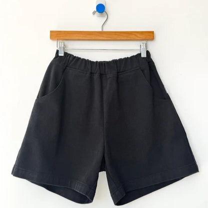 Black cotton cavas elastic high waisted city shorts by Le Bon Shoppe