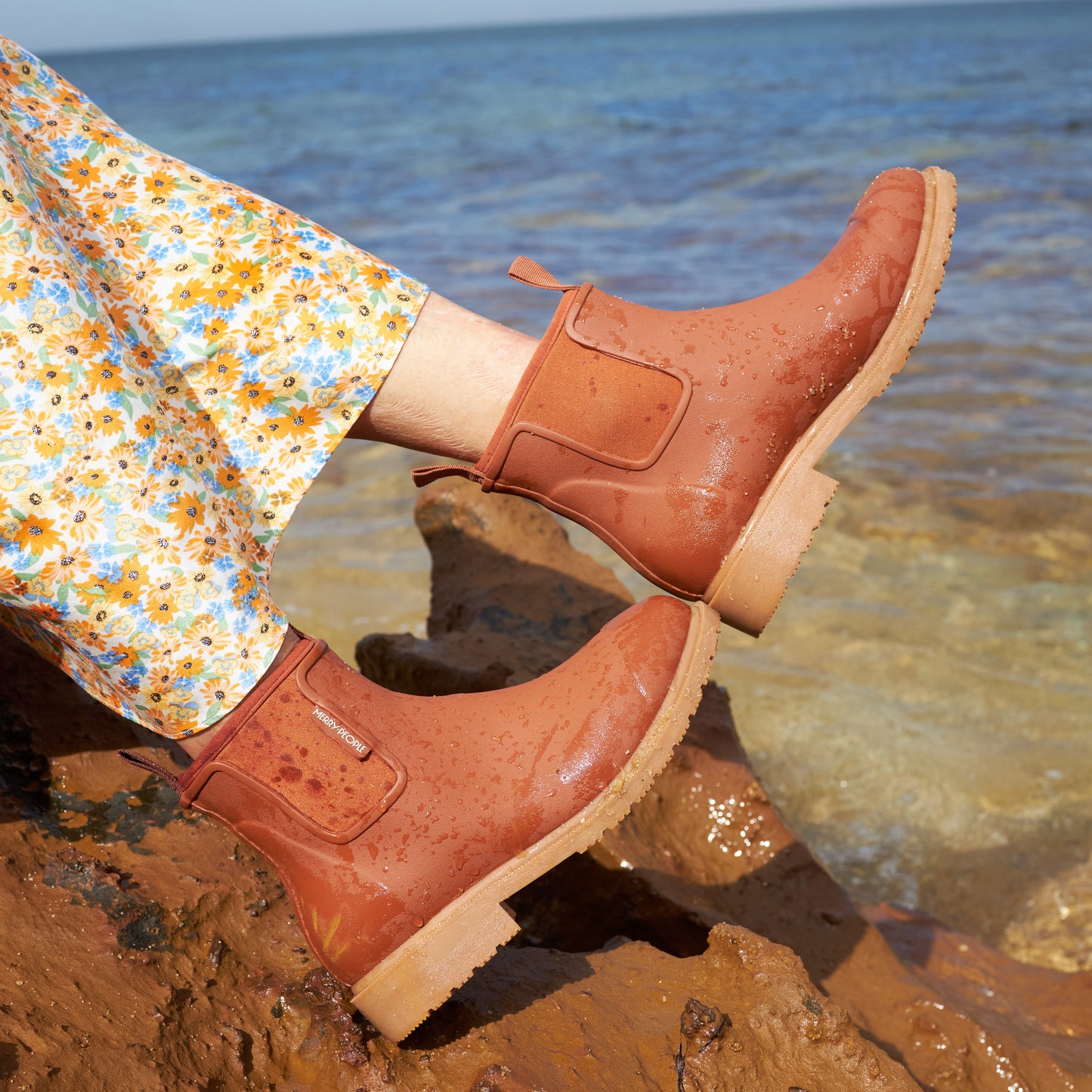 Rust terracotta Bobbi Rain Boot by Merry People at Clad, a sustainable clothing shop in Asheville, NC.