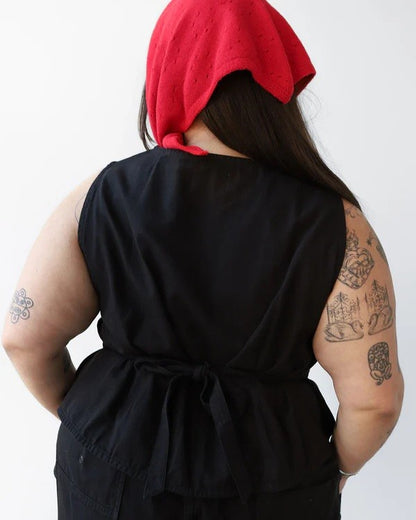 Noble shell utility vest in ash, paired with a red cashmere bandana