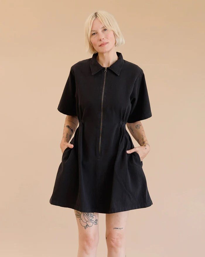 Noble utility dress in ash black with zipper front, peter pan collar, and side pockets at Clad, a sustainable clothing boutique in Asheville, NC