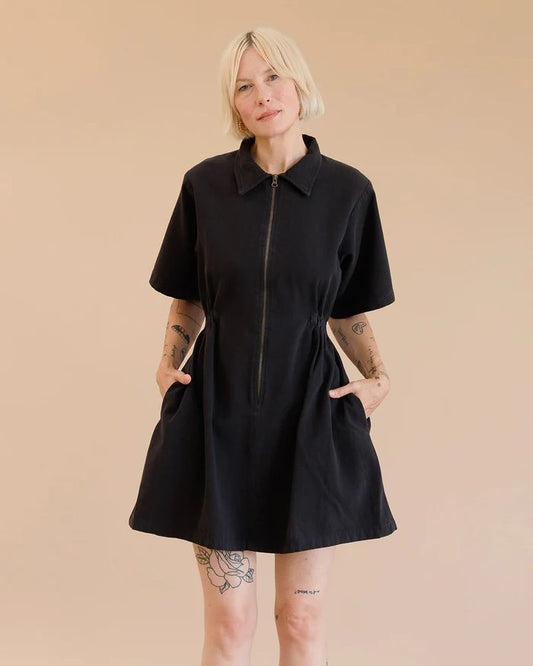 Noble utility dress in ash black with zipper front, peter pan collar, and side pockets at Clad, a sustainable clothing boutique in Asheville, NC
