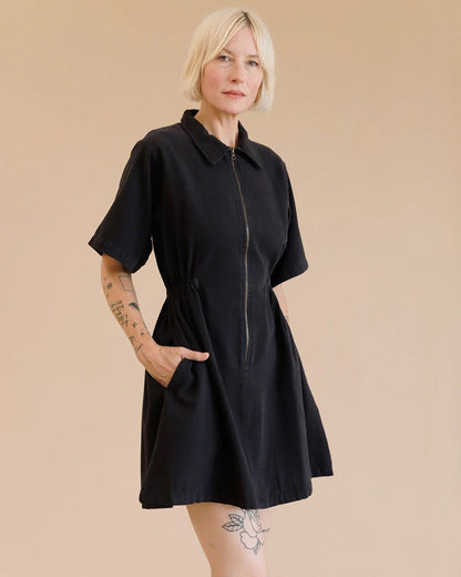 Noble utility dress in ash black with zipper front, peter pan collar, and side pockets at Clad, a sustainable clothing boutique in Asheville, NC