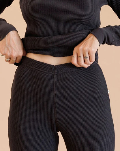 Noble waffle bottoms thermal pants in black at Clad, a sustainable clothing store in Asheville, NC