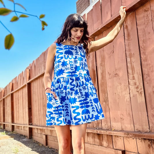 Blue and white abstract floral pattern Dutch Garden in a mini loose Big Pocket Dress by woman-owned brand Nooworks in California.