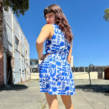 Blue and white abstract floral pattern Dutch Garden in a mini loose Big Pocket Dress by woman-owned brand Nooworks in California.