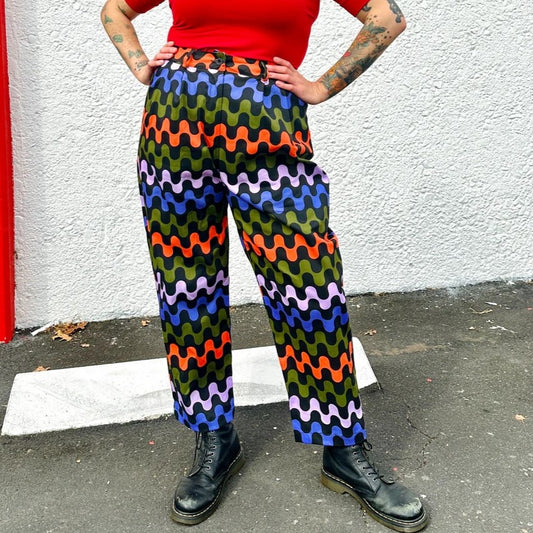 Ditto business pants with colorful red, green, and blue squiggles all over. Tapered leg, pleated front, and roomy pockets.