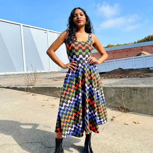 Ditto vacation dress with colorful red, green, and blue squiggles all over. Scoop neck, pockets, and stretchy.