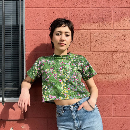 A stretchy floral crop top in a meadow print. Made in California by women-owned business Nooworks.