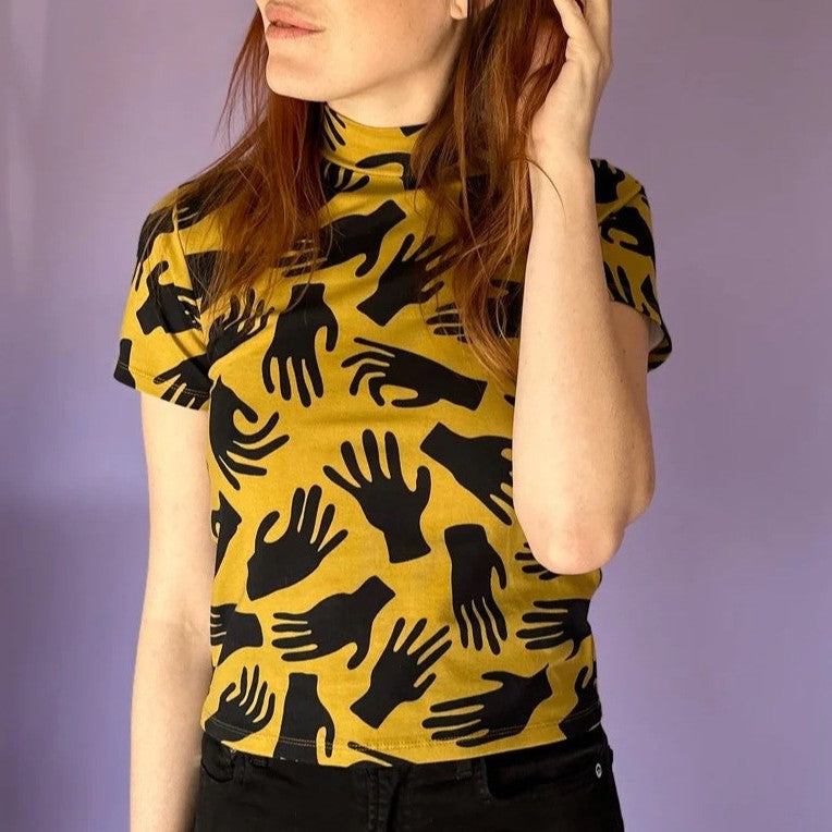 Nooworks mock neck in hands print at Clad, a sustainable clothing boutique in Asheville, NC