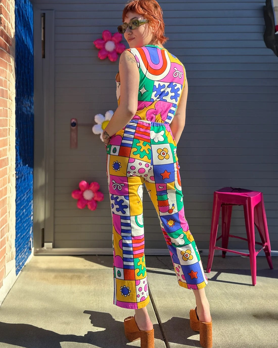 Nooworks Sonny Suit in Wormiverse, anabstract whimsical print with blue, green, yellow, pink, and red. Wrap style top with a wide leg and elastic waist at Clad, a sustainable clothing shop in Asheville, NC