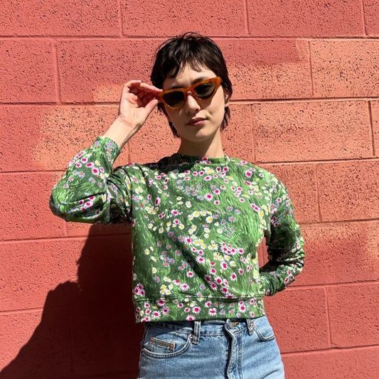 A long-sleeve floral track top in a meadow print. Made in California by women-owned business Nooworks.