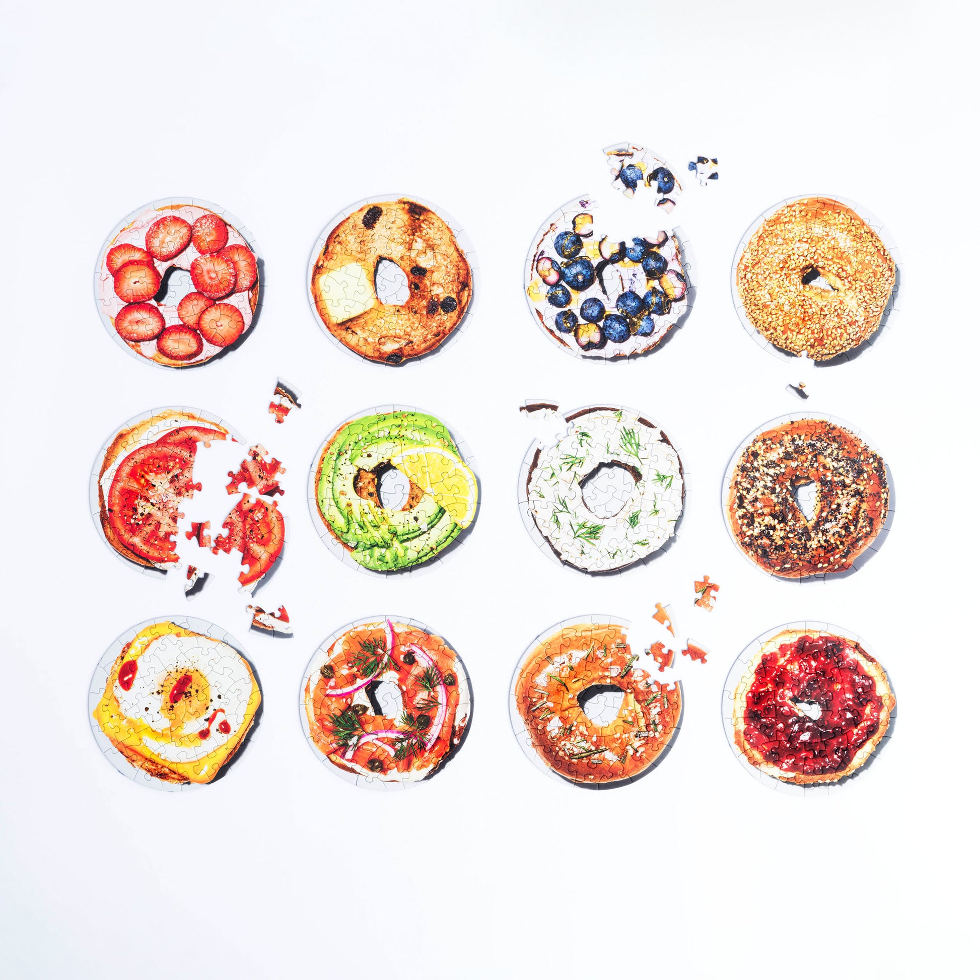 12 small 45-piece puzzles of various bagels.