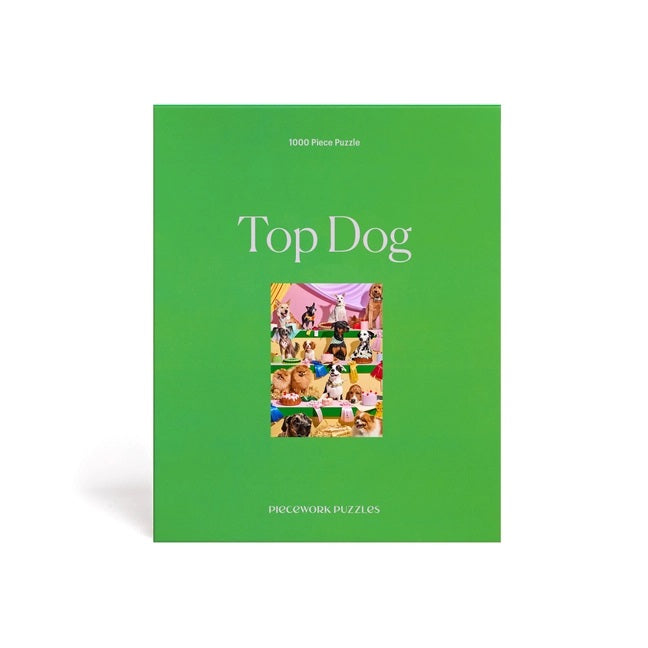 Top Dog 1000 piece puzzle by Piecework Puzzles. 14 dogs at a bake-off baking competition. Bright green box.