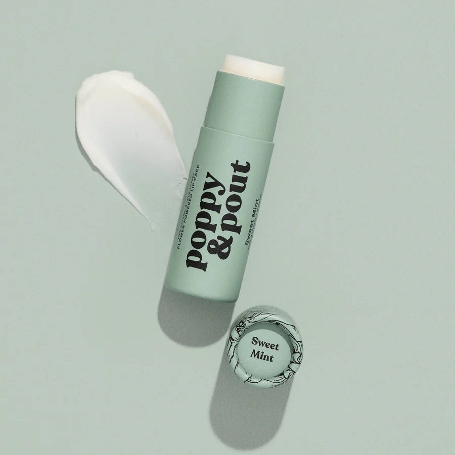 Poppy & Pout all-natural, cruelty-free lip balm in sweet mint peppermint flavor. Blue green recyclable tube.