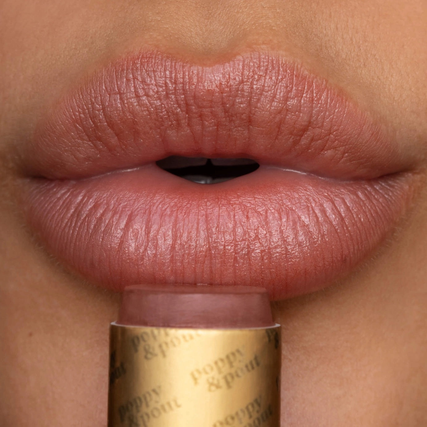 Poppy & Pout tinted lip balm dark peach Debbie