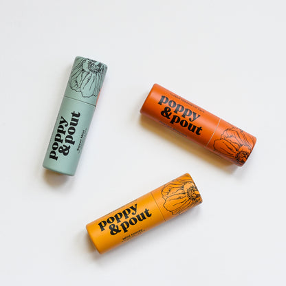 Natural lip balm by Poppy & Pout in Sweet Min, Wild Honey, and Orange Blossom.