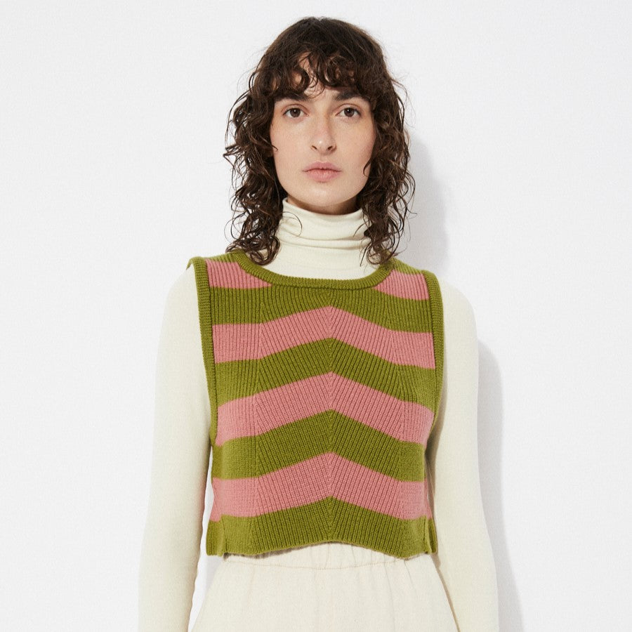 Pink and green Annie knit sweater vest with chevron stripes by Rita Row in Spain. Layered over an offwhite beige fitted turtleneck.