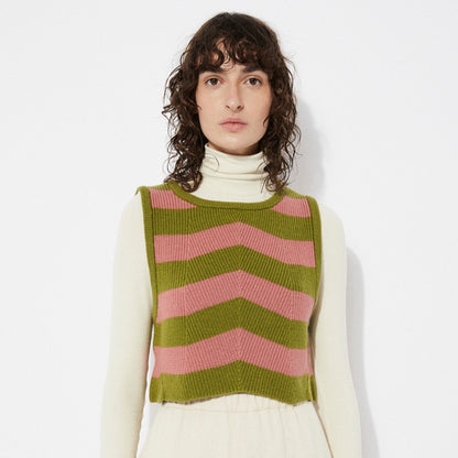 Pink and green Annie knit sweater vest with chevron stripes by Rita Row in Spain. Layered over an offwhite beige fitted turtleneck.