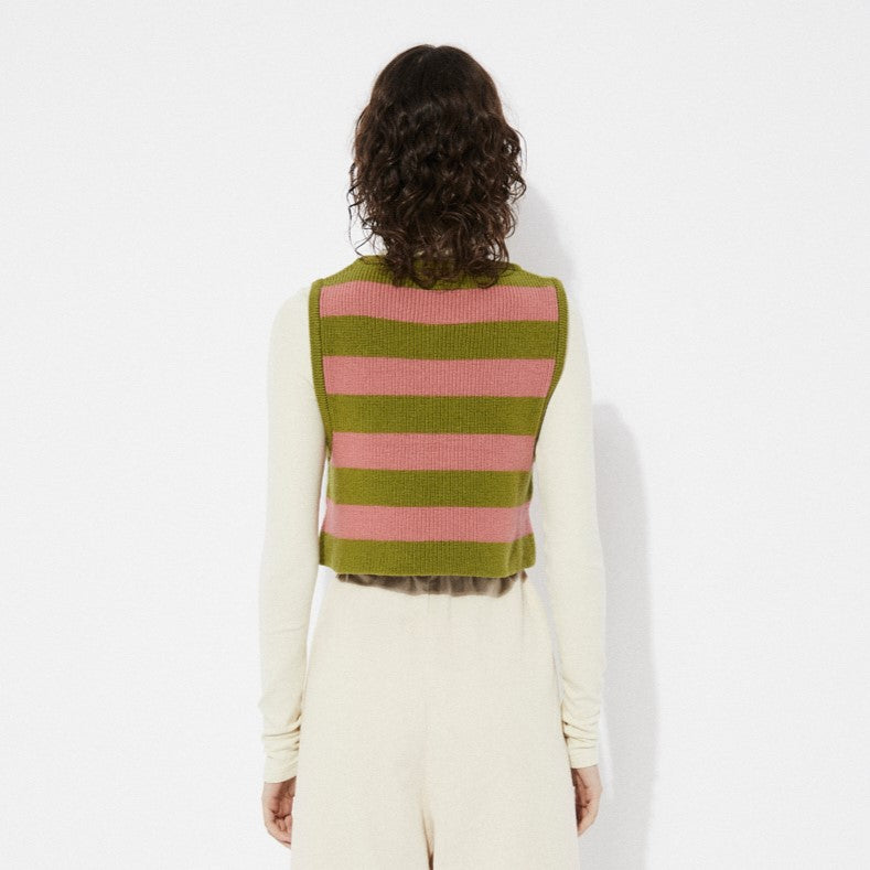 Pink and green Annie knit sweater vest with chevron stripes by Rita Row in Spain. Layered over an offwhite beige fitted turtleneck.