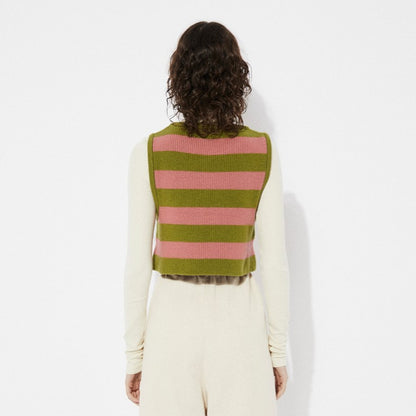 Pink and green Annie knit sweater vest with chevron stripes by Rita Row in Spain. Layered over an offwhite beige fitted turtleneck.