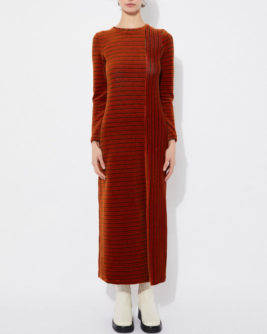 Long-sleeve velvet knit burnt orange rust Corba dres by Rita Row in Spain. Stripes and linework with a midi length and front slit. Paired with chunky white boots.