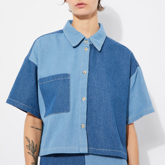 Patchwork denim blue button-down collar boxy shirt with short sleeves made by Rita Row in Spain.