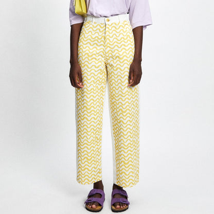 Luce yellow squiggle pattern print pant on white denim with a panel white back.