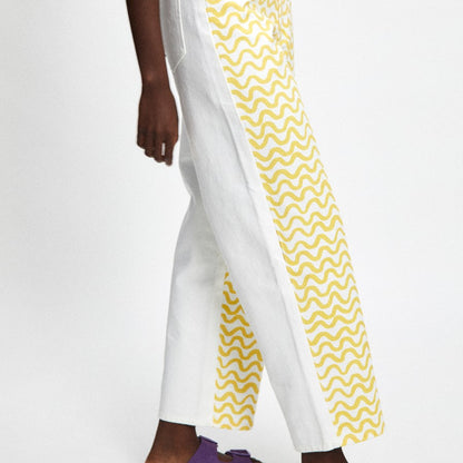 Luce yellow squiggle pattern print pant on white denim with a panel white back.