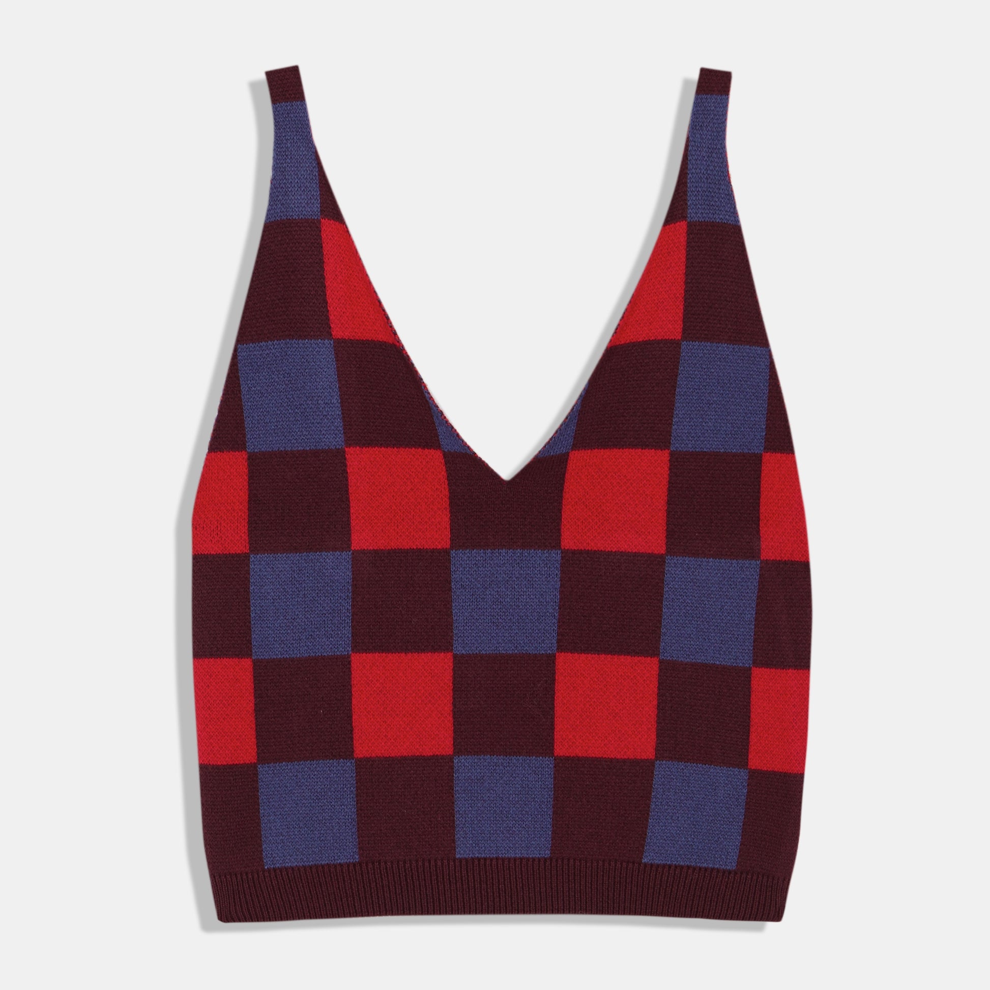 Sleeveless checkered sweater tank in burgundy, blue, and poppy red. V-neck with thick straps. Made by Rita Row in Spain.