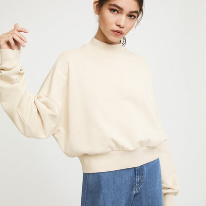 Natural beige white cream Pia sweatshirt from Rita Row with a drop shoulder and wide hem, sustainably made for the cold winter months.