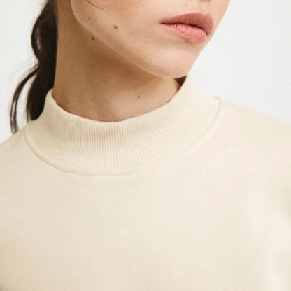 Natural beige white cream Pia sweatshirt from Rita Row with a drop shoulder and wide hem, sustainably made for the cold winter months.