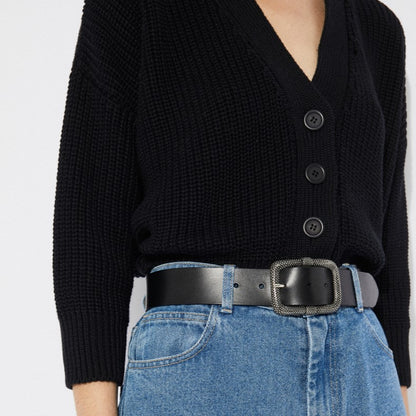 V-neck black knit Sclater cardigan with button-down front and v-neck. Made by Rita Row in Spain. Tucked into high-waisted jeans and paired with a black leather belt.