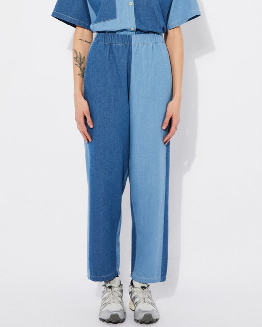 Elastic band high-waisted patchwork denim panel pants. Made by Rita Row in Spain. Paired with the matching Lagos top and sneakers.