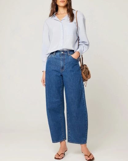 Gigi Dark Denim Barrel Jeans by Rolla's. High waist blue jeans, paired with a tucked button down shirt and heels.