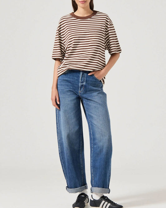 Rolla's Gigi barrel jeans in Paris Texas turn-up, paired with sneakers and a striped boxy tee.